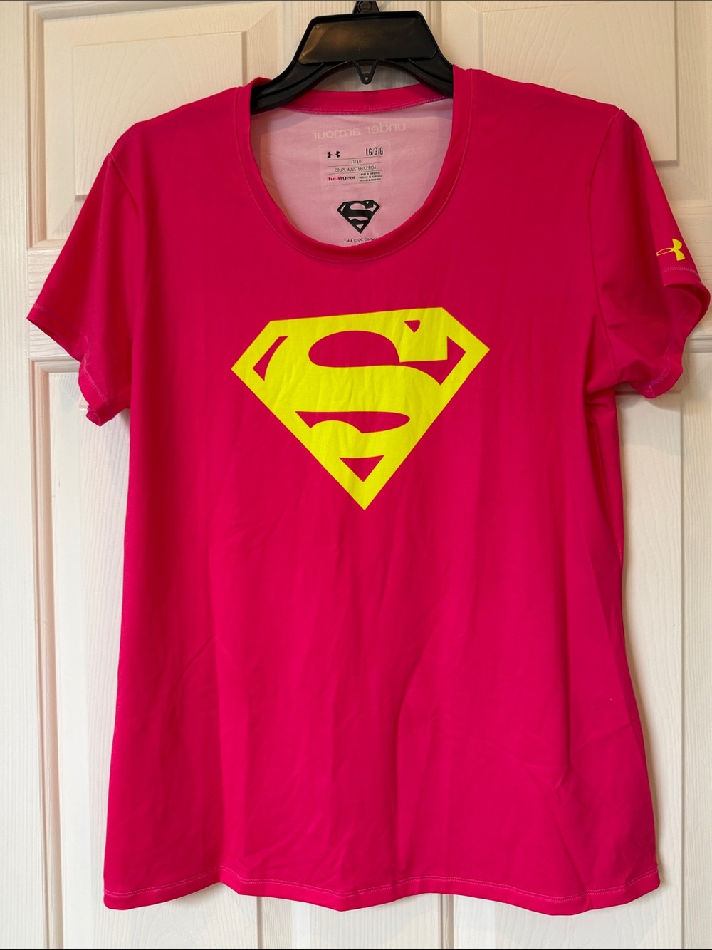 Under Armour HeatGear Women’s Hot Pink Tee with Yellow Supergirl Logo